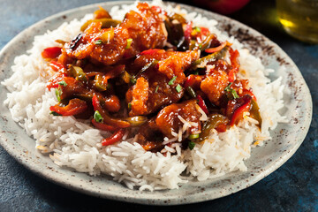 Wall Mural - Sweet and sour chicken with colorful bell pepper with rice