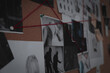 © New Africa - Detective board with crime scene photos, stickers, clues and red thread, closeup