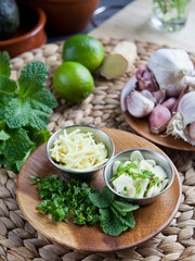 Sticker - Sliced garlic and ginger with healthy herbs -  coriander, mint and lime -  healthy diet ingredients with Asian inspiration.