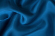 Dark blue fabric cloth texture for background and design art work, beautiful crumpled pattern of silk or linen.
