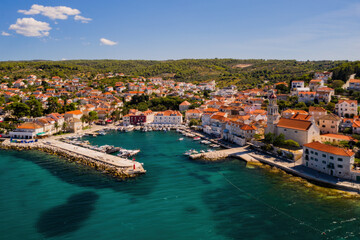 Wall Mural - Town of Sutivan skyline view, Island of Brac, Croatia. Aerial drone view in august 2020