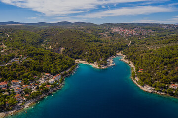 Wall Mural - SUMARTIN, CROATIA - august 2020: Aerial drone panorama of the quiet harbor, Brac Island east side on a summer morning.
