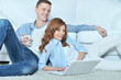 © aletia2011 - young man  and woman  using  laptop at home