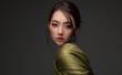 © Sofia Zhuravetc - Beautiful Asian woman in a green shawl. Beauty of mysterious Chinese girl with flowing hair. Fashion, clothing and cosmetics