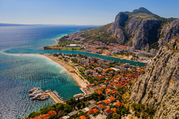Wall Mural - Panorama of town Omis in Croatia - travel background. Aerial drone picture in august 2020