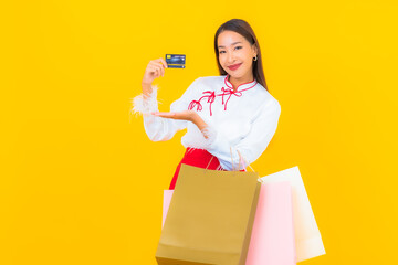 Portrait beautiful young asian woman with shopping bag and credit card