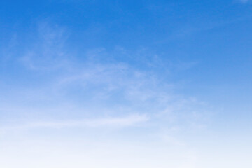 Bright blue sky with white cloud daytime background.