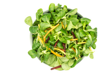 Wall Mural - Corn salad in bowl isolated on white background top view