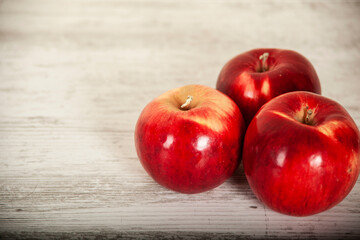 red apples on the table on a light background