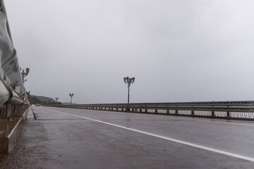 Mountain scenic asphalt road after rain. bridge