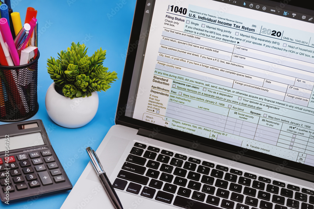 Tax Form 1040 on Laptop Screen on Light Blue Background Stock Photo ...
