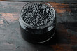 Black sturgeon caviar, on old dark  wooden table background