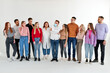 © Roman - sick male in medical mask stand among healthy people looking at him. group of people stand in a row looking at male standing in center, isolated on white studio background