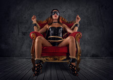 Sexy Woman In Lingerie And Bdsm Style In Old Armchair