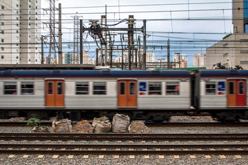 The train runs along on the emerald line 9 of CPTM, a Sao Paulo Metropolitan Train Company, located near to the Pinheiros River, in Sao Paulo.