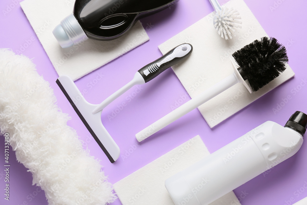 Set of cleaning supplies on color background