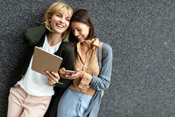 Wall Mural - Beautiful happy women friends having fun and good time together outdoor