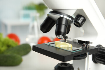 Wall Mural - slide with slice of lemon on microscope in laboratory, closeup. poison detection