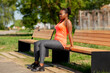 © Syda Productions - fitness, sport and healthy lifestyle concept - young african american woman doing bench triceps dip outdoors