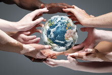 Hands Holding, Touching Planet Earth, Close Up On Grey Background. Environment Save, Taking Care Of Nature And Ecology, Supporting Hands Concept. Globe Woldwide Protection, Traveling. Beauty.