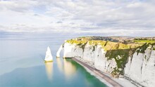 4K Timelapse Sequence Of Étretat, France - The Iconic Striking Rock Formations Carved Out Of Its White Cliffs Of Etretat Close Up