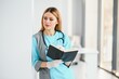 © Serhii - Beautiful smiling doctor woman in medical gown