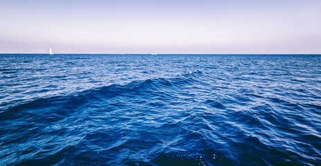 Canvas Print - Beautiful minimalistic landscape, the surface of the ocean under the blue sky. Natural abstract background