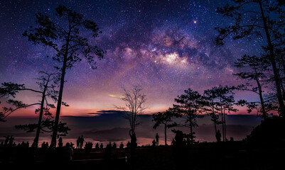 Wall Mural - silhouette many tourists come to wait for the sunrise in the morning while the milky way is in the s