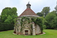 DORCHESTER, DORSET, UK - AUGUST 21ST 2020: A Dovecote With Ivy Growing On It, Stands In The Ground Of An English Stately Home