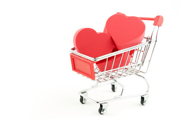 Wall Mural - grocery cart and hearts inside, the concept of love by calculation