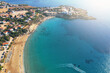 Aerial view of Cyprus lagoon sandy beach and blue sea water, tropical resort from above.