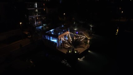 Poster - Wedding party on the pier in a seaside restaurant, people dancing on the dance floor