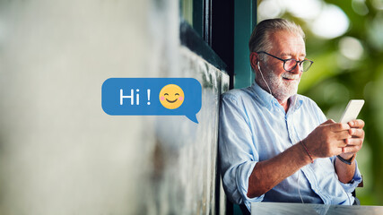 Canvas Print - Elderly man texting on his smartphone