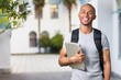 © BillionPhotos.com - Smiling young college student with laptop