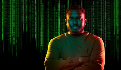 Wall Mural - technology, cyberspace and programming concept - portrait of young african american man over binary code numbers on black background