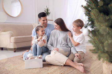 Sticker - Happy family with cute children near Christmas tree together at home