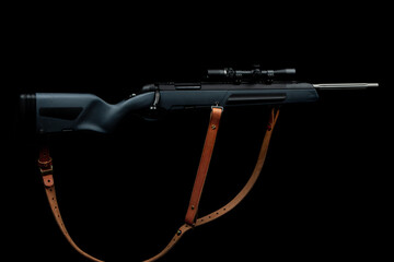 Scout rifle on black background, bolt rifle on black background, scope with enlarged airelif, soft focus