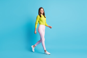 Wall Mural - full body profile side photo of young beauiful woman smile go walk weekend isolated over blue color 