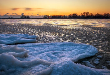 Wall Mural - Sunrise and frozen river. Beautiful winter landscape with lake in morning time. Daybreak