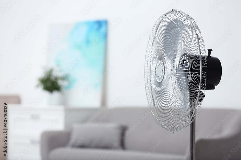 Modern electric fan in room. Space for text - obrazy, fototapety, plakaty 
