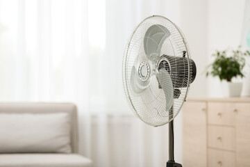 Sticker - Modern electric fan in room. Space for text