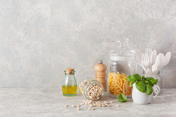 Canvas Print - kitchen utensils on modern simple counter, kitchenware jars with dry ingredients bowls