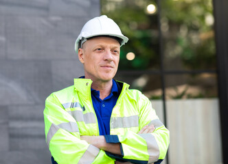 Wall Mural - Portrait of Technician Electrical Engineer at rooftop building. Clean and green alternative energy concept.