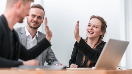 Poster - confident business colleagues giving each other a high five