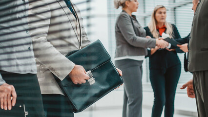 Poster - group of business people are preparing for the beginning of the working meeting