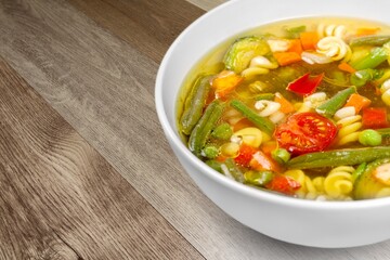 Poster - Bowl of delicious vegetable soup on a table