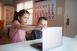 © Gemütlichkeit - boy and girl looking at a laptop with a worried and confused look