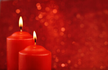 Wall Mural - Red burning candles on red bokeh