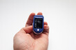 © Larisa - Medical device oximeter in the palm of a man