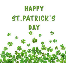 Happy St. Patrick's Day. Green Clover Leaves On White Background